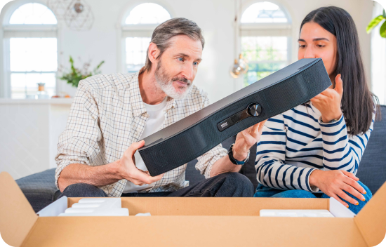 Man holding the Mirai Speaker with his daughter